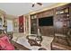 Relaxing living room with built-in entertainment center and leather furniture at 3649 N Hudson Dr, Florence, AZ 85132