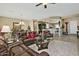 Open living area showcasing comfortable leather seating and a view into the kitchen at 3649 N Hudson Dr, Florence, AZ 85132