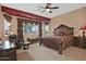 Spacious main bedroom with a king-size bed and seating area at 3649 N Hudson Dr, Florence, AZ 85132