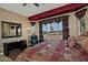 Main bedroom with backyard view, large windows and ceiling fan at 3649 N Hudson Dr, Florence, AZ 85132