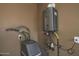 Utility room with water heater and water softener at 3649 N Hudson Dr, Florence, AZ 85132