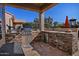 Outdoor kitchen features a built-in grill and mini-fridge at 3649 N Hudson Dr, Florence, AZ 85132