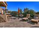 Enjoy the Arizona sunshine on this expansive patio with lounge chairs at 3649 N Hudson Dr, Florence, AZ 85132