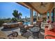 Relaxing patio with wicker furniture, a hot tub, and pool access at 3649 N Hudson Dr, Florence, AZ 85132