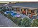 Night view of a kidney shaped pool and spa at 3649 N Hudson Dr, Florence, AZ 85132