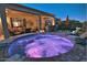 Round spa with purple lighting at night at 3649 N Hudson Dr, Florence, AZ 85132