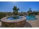 Relaxing spa with stonework, adjacent to a refreshing pool at 3649 N Hudson Dr, Florence, AZ 85132