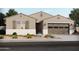 Single-story home with two-car garage and landscaping at 37053 W La Paz St, Maricopa, AZ 85138