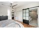 Bright bedroom with ensuite bathroom and sliding barn door at 3929 E Mercer Ln, Phoenix, AZ 85028