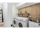 Laundry room with modern washer and dryer at 3929 E Mercer Ln, Phoenix, AZ 85028