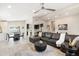 Open concept living area with leather sectional sofa and dining area at 3929 E Mercer Ln, Phoenix, AZ 85028