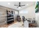 Home office with wood desk and leather chair at 3929 E Mercer Ln, Phoenix, AZ 85028