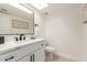 Modern bathroom with white vanity, quartz countertop, and toilet at 4129 W Hearn Rd, Phoenix, AZ 85053