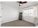 Well-lit bedroom with built-in shelving and window at 4129 W Hearn Rd, Phoenix, AZ 85053