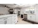 Stylish kitchen with white cabinetry, quartz countertops and modern appliances at 4129 W Hearn Rd, Phoenix, AZ 85053