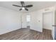 Well-lit bedroom with walk-in closet and ceiling fan at 4608 W Maryland Ave # 125, Glendale, AZ 85301