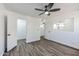 Spacious bedroom featuring wood-look floors and ample closet space at 4608 W Maryland Ave # 125, Glendale, AZ 85301