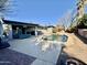 Backyard pool is surrounded by a concrete patio, with a view of the home at 511 E Port Au Prince Ln, Phoenix, AZ 85022