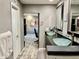 Modern bathroom featuring dual glass vessel sinks, black cabinets, and stylish fixtures at 511 E Port Au Prince Ln, Phoenix, AZ 85022