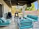 Inviting covered patio with outdoor seating and a ceiling fan, perfect for entertaining at 511 E Port Au Prince Ln, Phoenix, AZ 85022