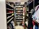 Custom walk-in closet with ample shelving, hanging space, and efficient storage solutions at 511 E Port Au Prince Ln, Phoenix, AZ 85022