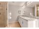 Modern bathroom with double vanity and large mirror at 5315 W Christy Dr, Glendale, AZ 85304