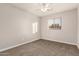 Bright bedroom featuring a ceiling fan and window at 5315 W Christy Dr, Glendale, AZ 85304