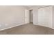 Spacious bedroom with ample closet space and neutral carpeting at 5315 W Christy Dr, Glendale, AZ 85304