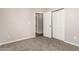 Bedroom with double door closet and carpet flooring at 5315 W Christy Dr, Glendale, AZ 85304