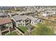 Aerial view of the backyard featuring a covered patio, pergola with seating, and manicured lawn at 55 N Abalone Ct, Gilbert, AZ 85233