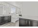 Bathroom featuring separate vanities, a soaking tub, and neutral paint at 55 N Abalone Ct, Gilbert, AZ 85233