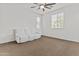 Bright bedroom with neutral carpet, natural light and white couch at 55 N Abalone Ct, Gilbert, AZ 85233