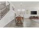 Dining room featuring hardwood floors and a table with six chairs at 55 N Abalone Ct, Gilbert, AZ 85233