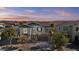 Aerial view of the two-story home with a tile roof and neutral colored stucco at sunset at 55 N Abalone Ct, Gilbert, AZ 85233