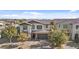 Aerial view of the two-story home with a tile roof, shutters, and a neutral colored stucco at 55 N Abalone Ct, Gilbert, AZ 85233