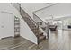 Bright foyer with a staircase leading to the second level and an open view to the living room at 55 N Abalone Ct, Gilbert, AZ 85233