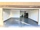 Well-lit garage with finished epoxy floor with decorative flecks, providing secure parking at 55 N Abalone Ct, Gilbert, AZ 85233