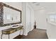 Hallway with decorative table and large mirror at 55 N Abalone Ct, Gilbert, AZ 85233