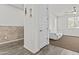 Cozy living room showcases a connecting hallway and a partial exposed brick wall at 55 N Abalone Ct, Gilbert, AZ 85233