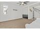 Spacious living room with natural light, neutral carpet, and built-in storage creating a comfortable space at 55 N Abalone Ct, Gilbert, AZ 85233