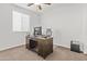 Home office with window, ceiling fan and neutral carpet at 55 N Abalone Ct, Gilbert, AZ 85233