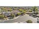 Overhead view of a suburban neighborhood with houses, mature landscaping, and tree-lined street at 55 N Abalone Ct, Gilbert, AZ 85233