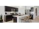 Kitchen island with marble countertop and seating for three at 5530 E Rock Bush Ln, San Tan Valley, AZ 85140