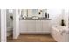 Main bathroom with white cabinets, granite countertop, and soaking tub at 5814 S Daisy Patch Pl, Phoenix, AZ 85040