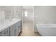 Modern bathroom with double vanity and free-standing tub at 615 N Vine St, Chandler, AZ 85225