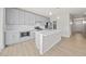 Modern kitchen with gray cabinets, white counters, and island at 615 N Vine St, Chandler, AZ 85225