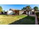 Backyard view of home, storage shed, and landscaping at 6258 E Ivy St, Mesa, AZ 85205