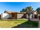 Backyard view of home, storage shed, and landscaping at 6258 E Ivy St, Mesa, AZ 85205