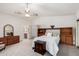 Bright bedroom with built-in shelving and access to the bathroom at 6258 E Ivy St, Mesa, AZ 85205