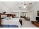 Comfortable bedroom with mirrored closet and ceiling fan at 6258 E Ivy St, Mesa, AZ 85205